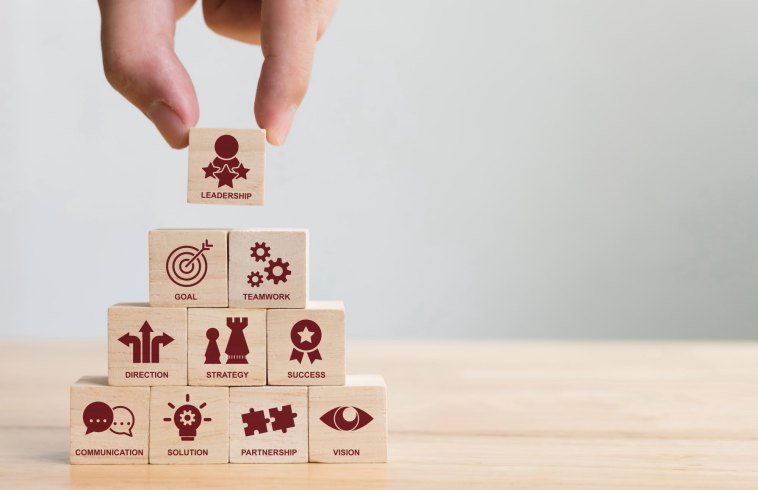 Hand arranging wood block stacking with icon